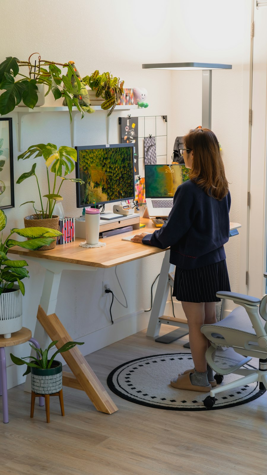 The same desk raised so the founder can work standing